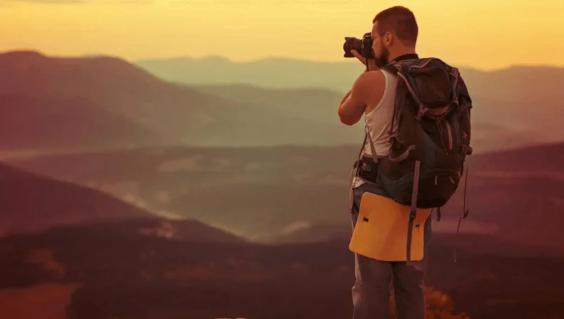 a photographer in sunset