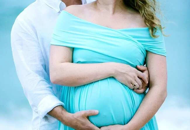 Parents holding their hands