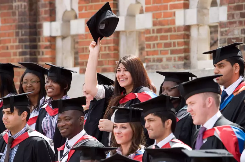Graduation Photo Ideas In Front of the School's Mascot or Emblem